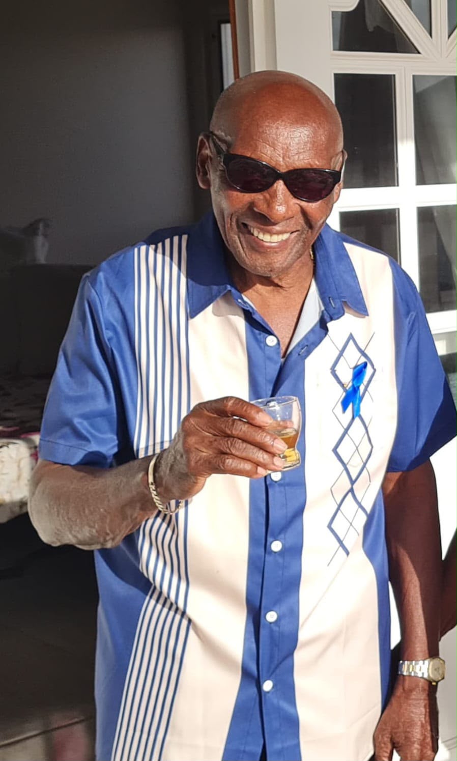 Grandad, smiling in sunglasses